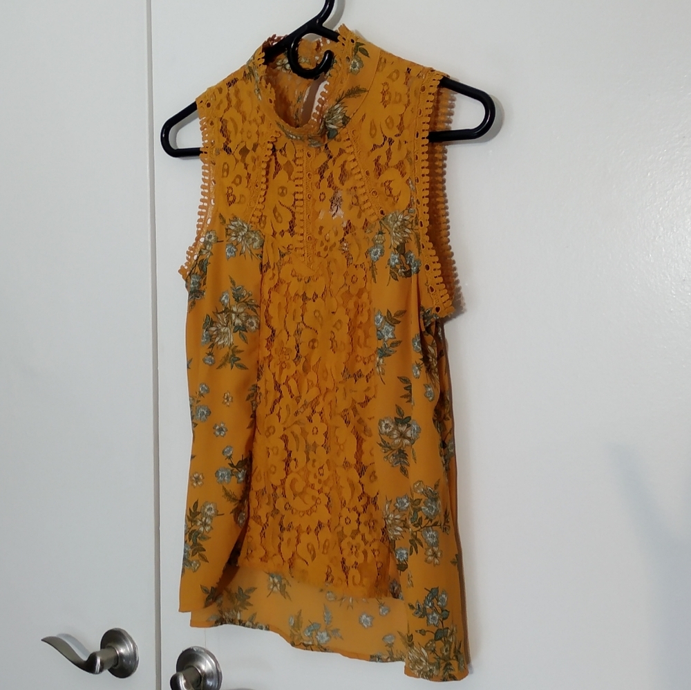 Lacey mock neck sleeveless blouse
